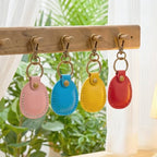 4 Pack Genuine Leather Airtag Holder Compatible with Apple AirTag Keychain 2nd & 1st Gen (Pink/Light Blue/Yellow/True Red)